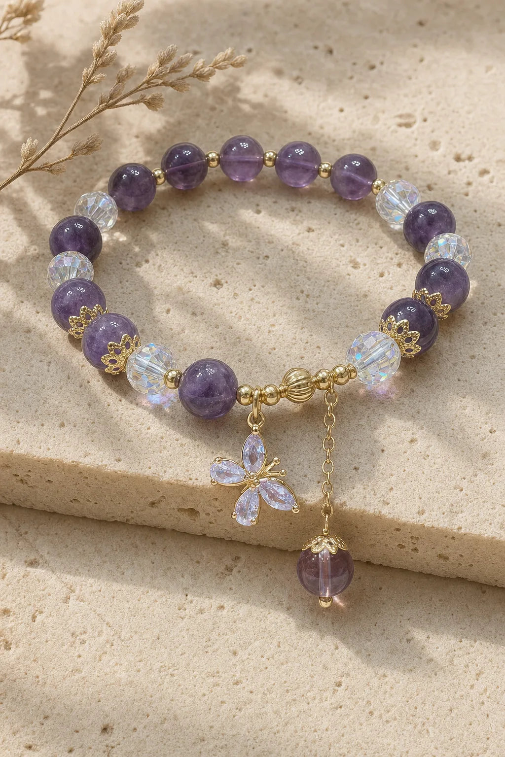 Amethyst Butterfly Bracelet, ZAIA jewelry, hero view. HERO — Editorial still life. Warm natural light, low-contrast editorial photography.