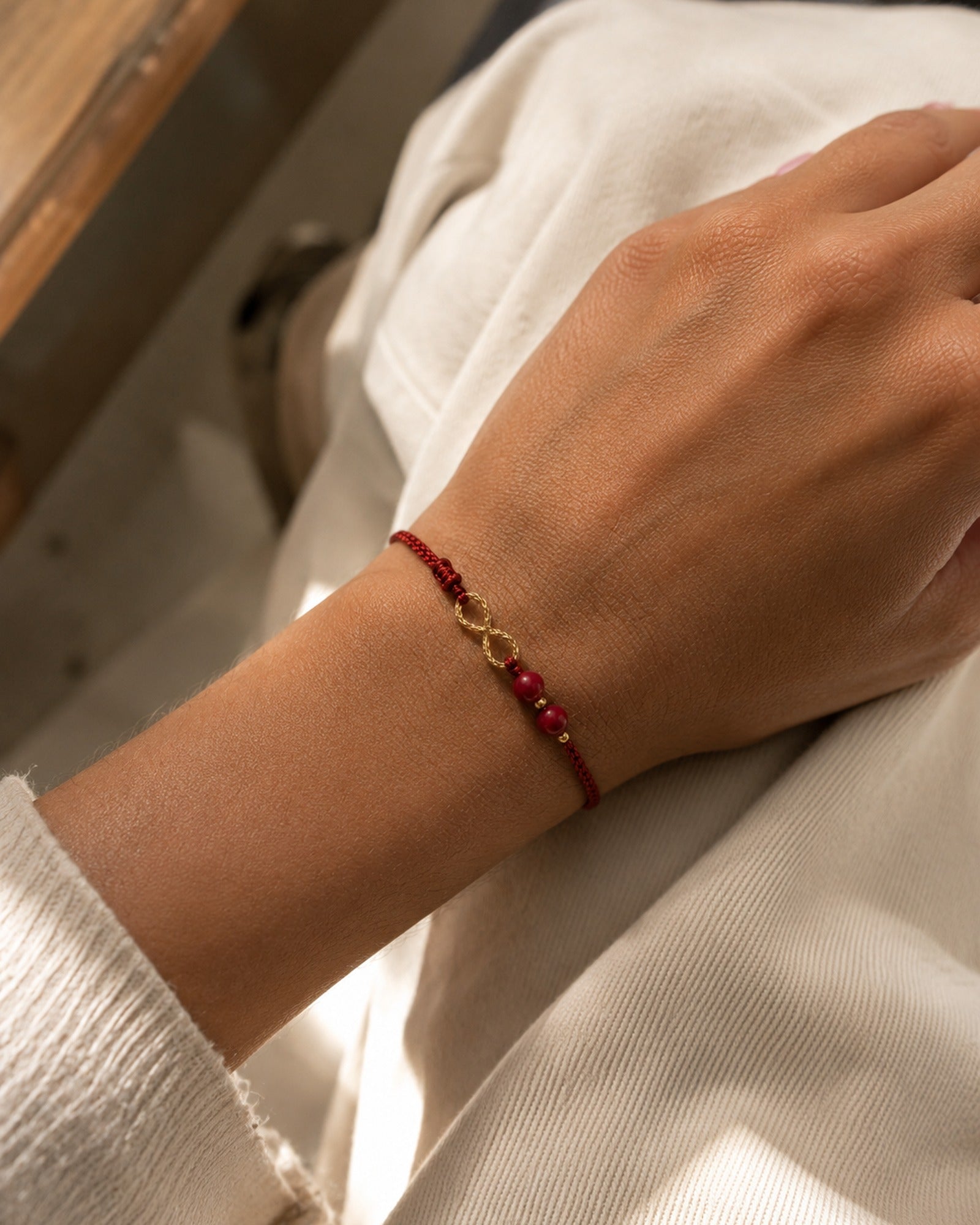 Cinnabar Infinity Bracelet worn
