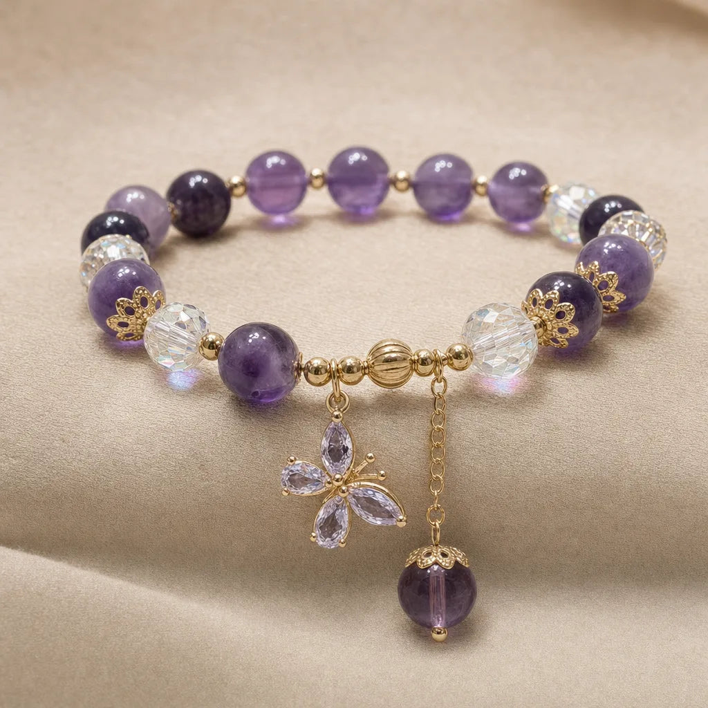 Amethyst Butterfly Bracelet, ZAIA jewelry, pack view. PACK — Studio product. Warm natural light, low-contrast editorial photography.
