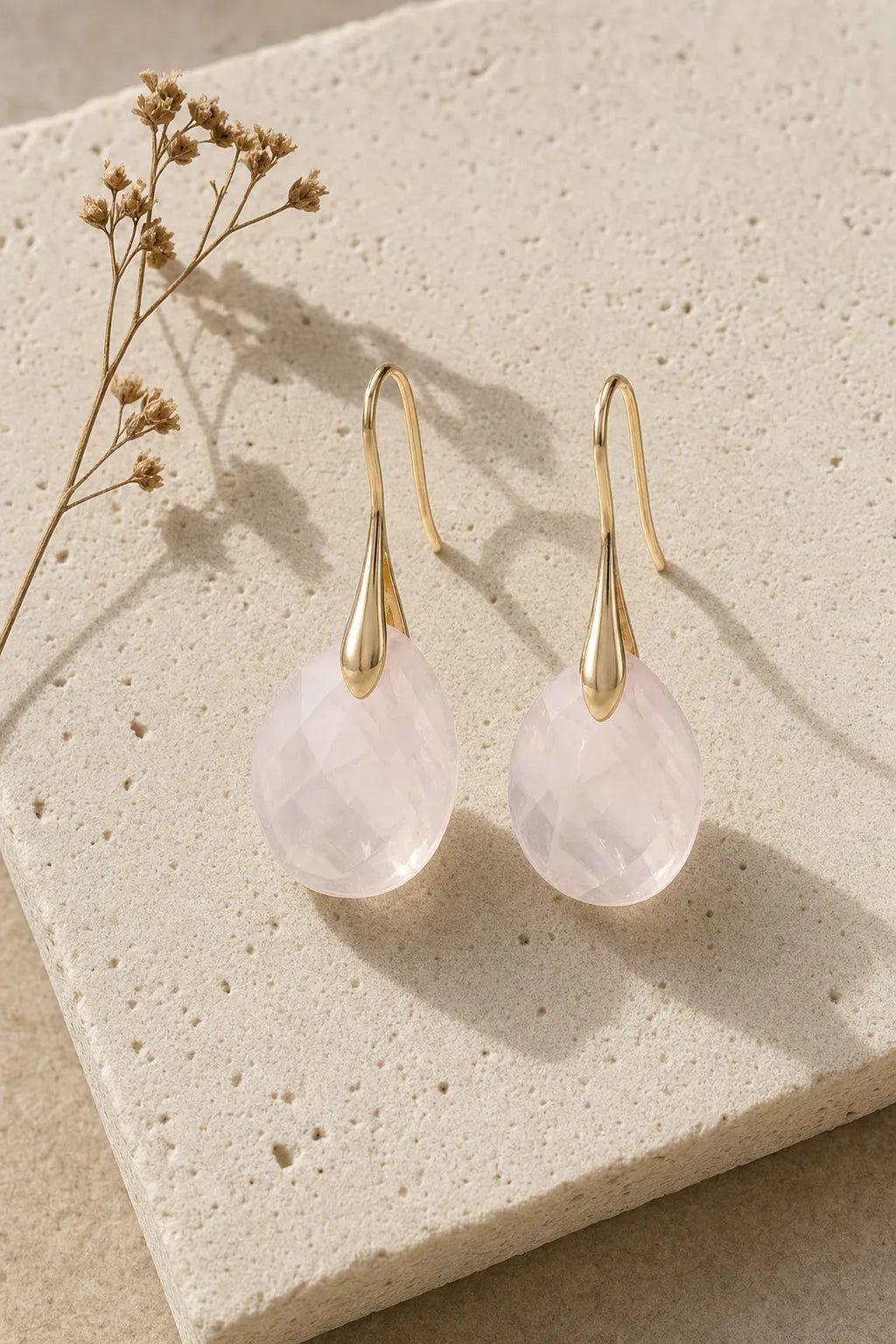 Compassion Rose Quartz Drop Earrings - Silver Plated, ZAIA jewelry, hero view. HERO — Editorial still life. Warm natural light, low-contrast editorial photography.