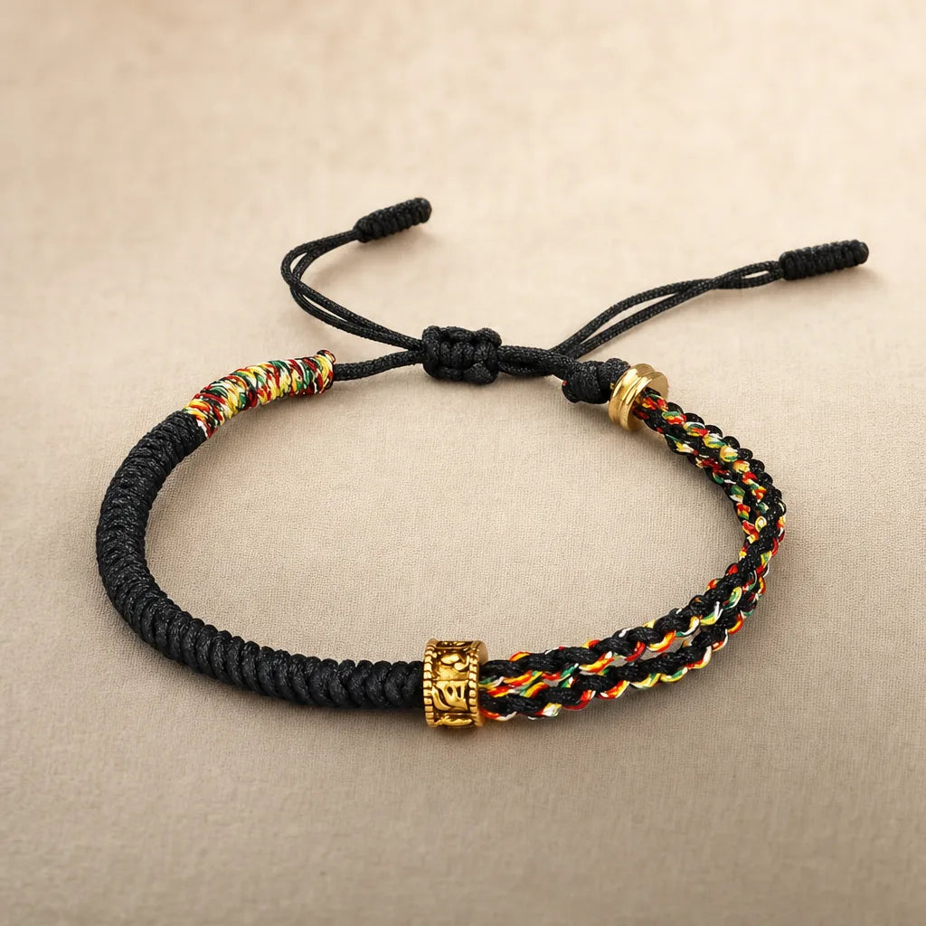 Om Mani Padme Hum Cord Bracelet, ZAIA jewelry, pack view. PACK — Studio product. Warm natural light, low-contrast editorial photography.