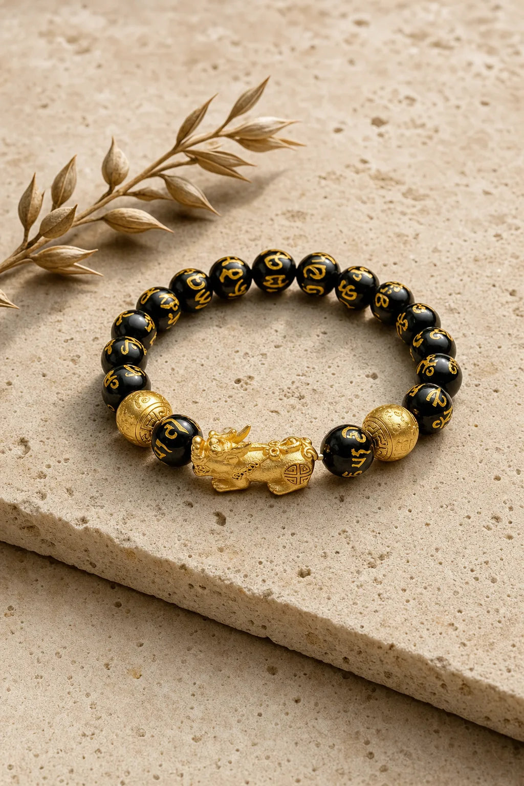 PiXiu Obsidian Bracelet - FengShui Wealth Mantra Beads, ZAIA jewelry, hero view. HERO — Editorial still life. Warm natural light, low-contrast editorial photography.
